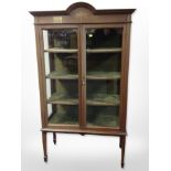 An early-20th century inlaid mahogany display cabinet with brass presentation plaque dated 1924,