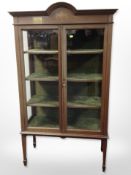 An early-20th century inlaid mahogany display cabinet with brass presentation plaque dated 1924,