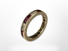 A 9ct yellow gold synthetic ruby and diamond full eternity ring, size I/J.