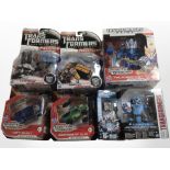 Six Hasbro Transformers figurines, boxed.