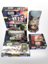Six Hasbro and other Star Wars figurines, boxed.