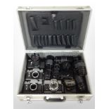 An aluminium camera case containing assorted cameras and lenses including Praktica, Zenit, Aires,