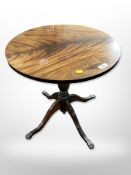 A reproduction mahogany circular pedestal table,