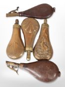 A James Dixon & Sons copper and brass powder measure, two further copper examples,