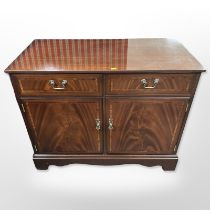 A reproduction mahogany side cabinet,