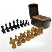 A stained boxwood chess set in oak box, kings 7cm tall.