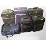 Six various luggage cases including Antler.