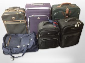 Six various luggage cases including Antler.