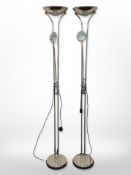 A pair of contemporary chrome uplighters, height 181cm.