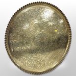 A large decorative brass charger, diameter 65cm.