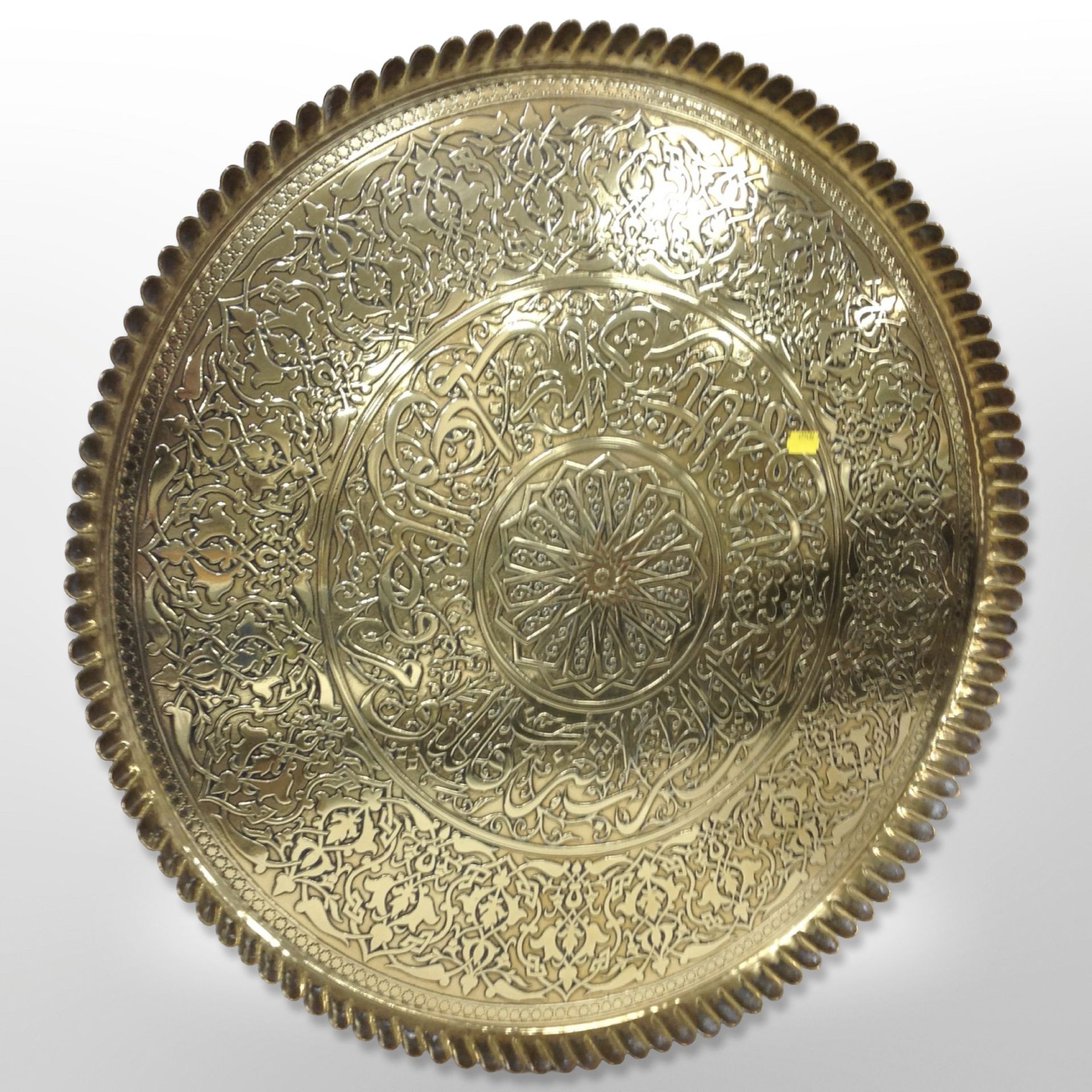 A large decorative brass charger, diameter 65cm.