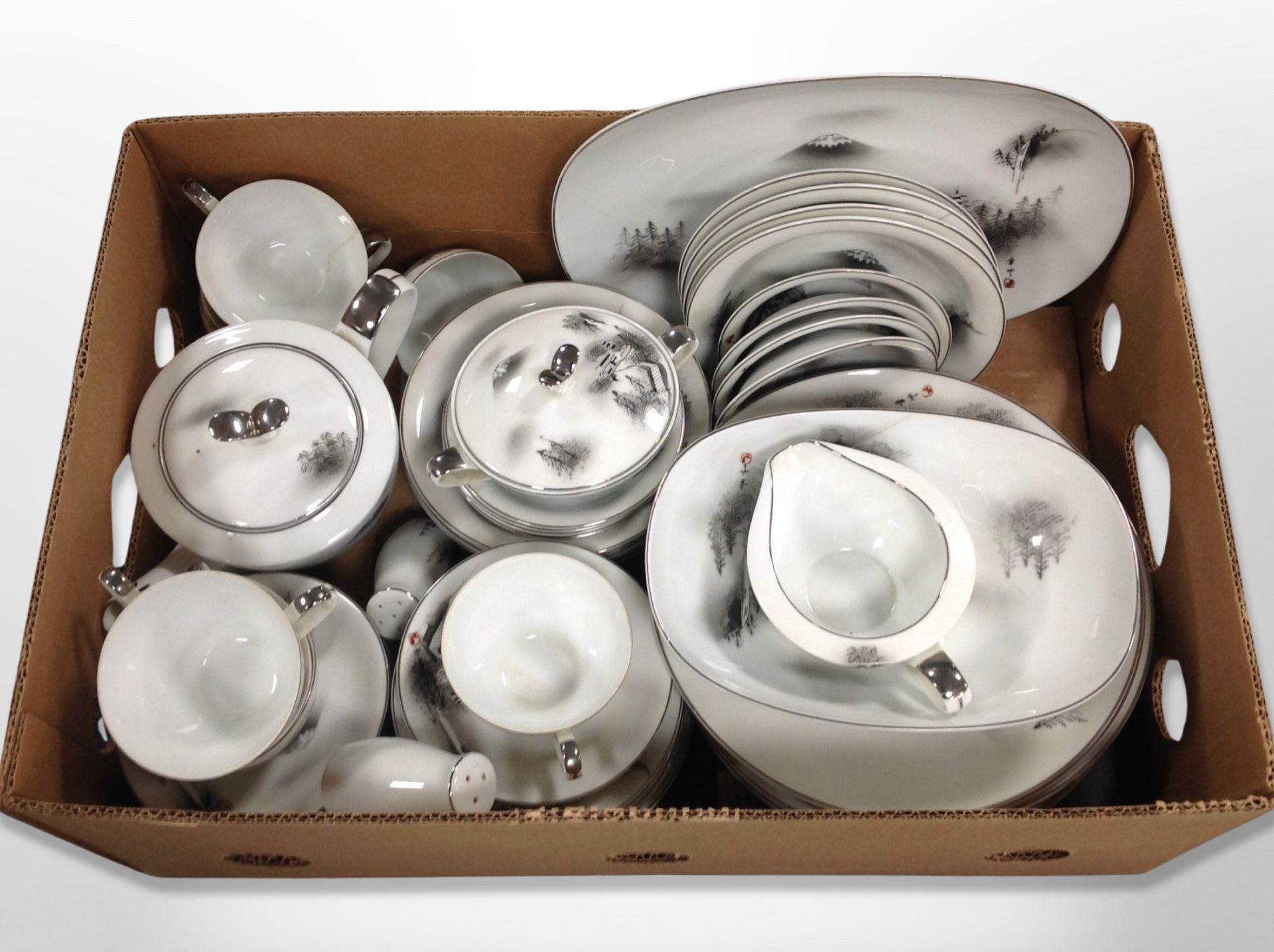 A box of Japanese export porcelain tea and dinner wares