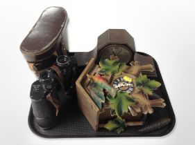 A continental cuckoo clock with weights, together with a pair of Soviet binoculars in leather case,