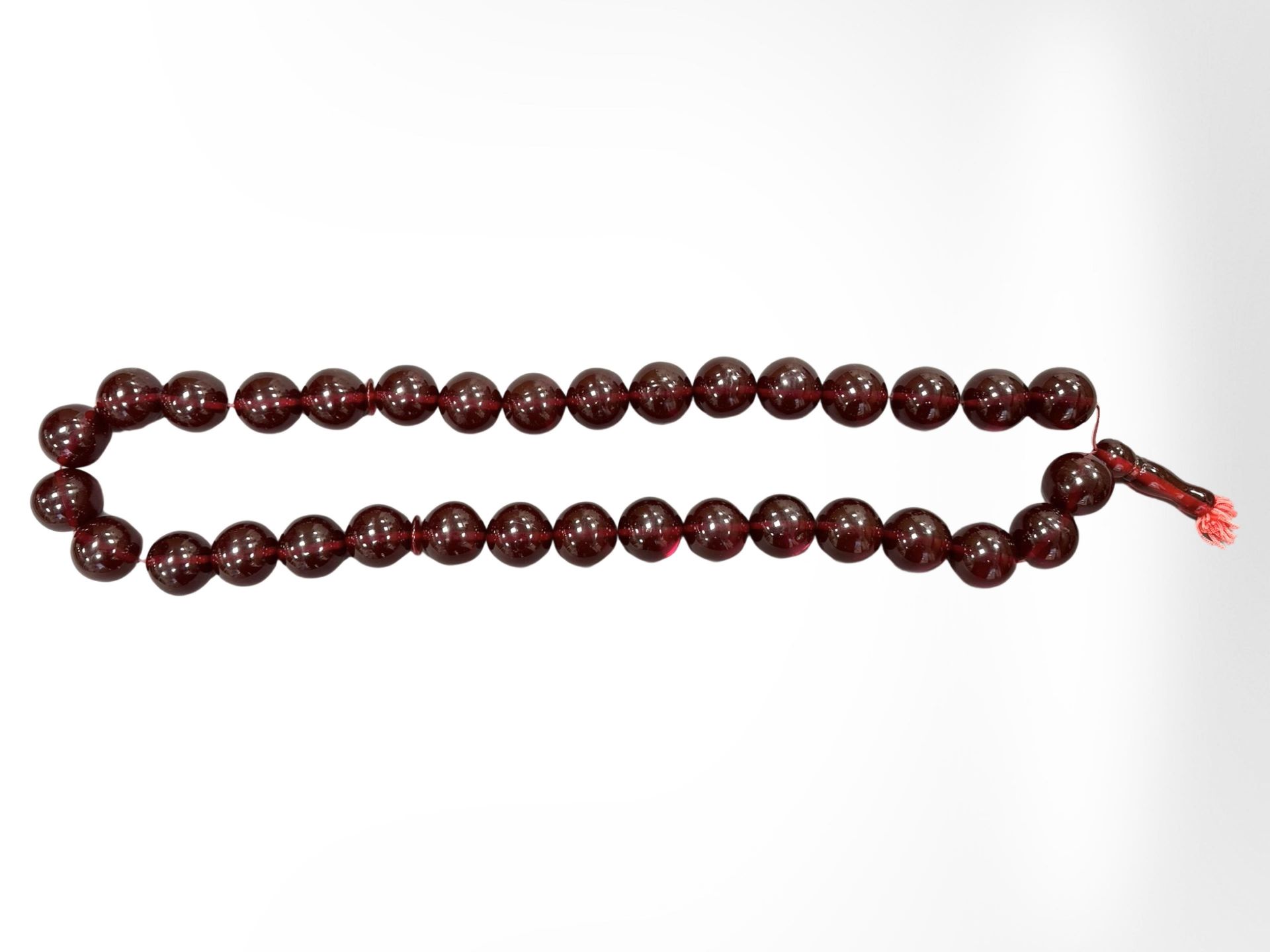 An impressive large cherry amber necklace with thirty three large spherical beads, - Image 2 of 4