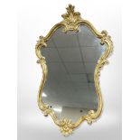 A reproduction gilt cartouche-shaped mirror,