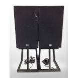 A pair of Rotel speakers on metal stands, height 75cm.