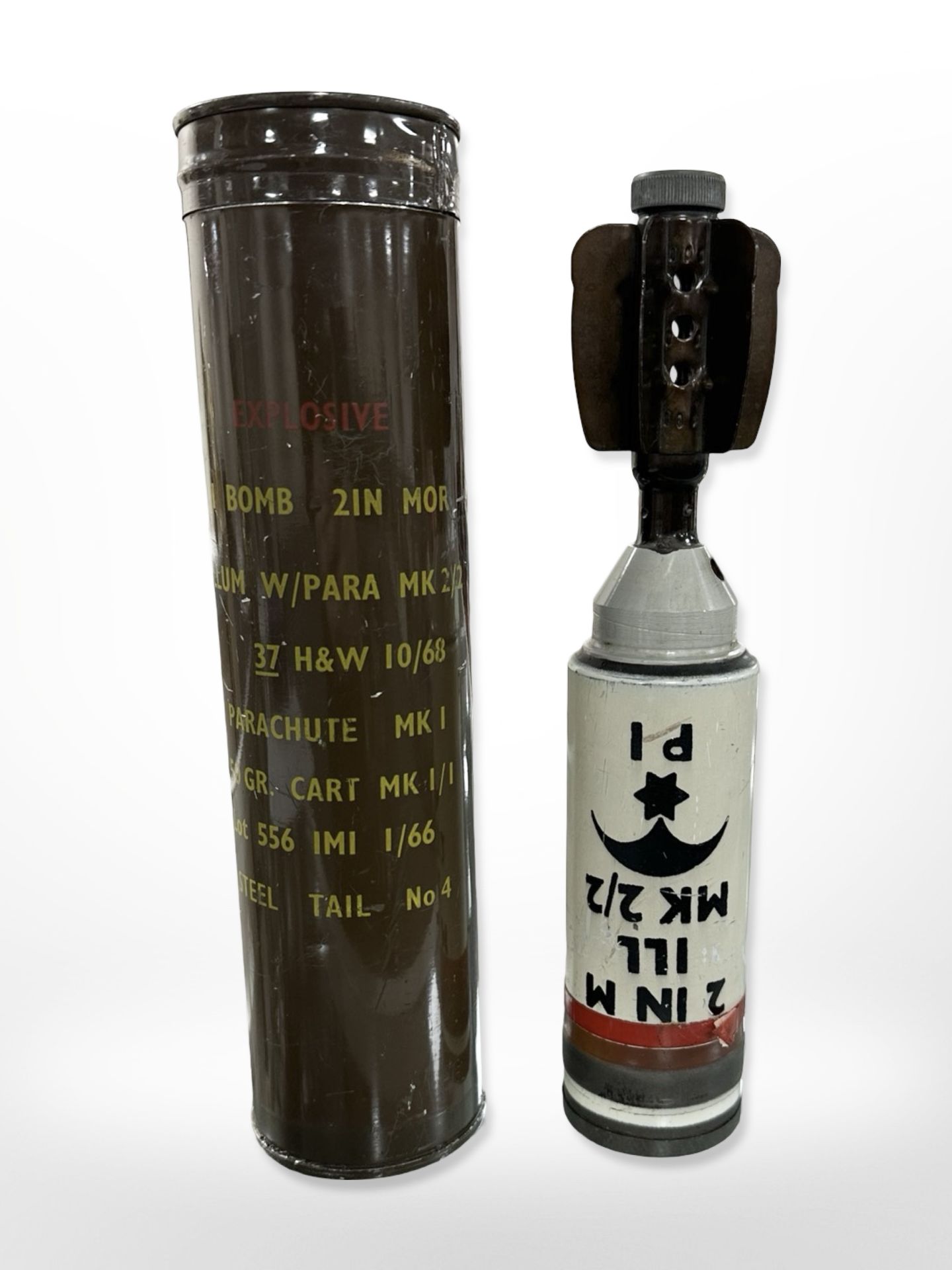 A 2-inch training mortar shell, Illum W/Para Mk II/II, in cylindrical case dated 1968.