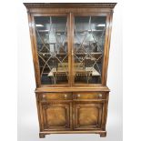 A reproduction mahogany bookcase in the George III style,