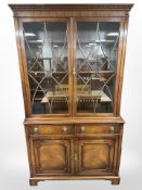 A reproduction mahogany bookcase in the George III style,