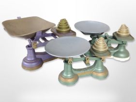 A group of antique enamelled cast-iron scales with weights.