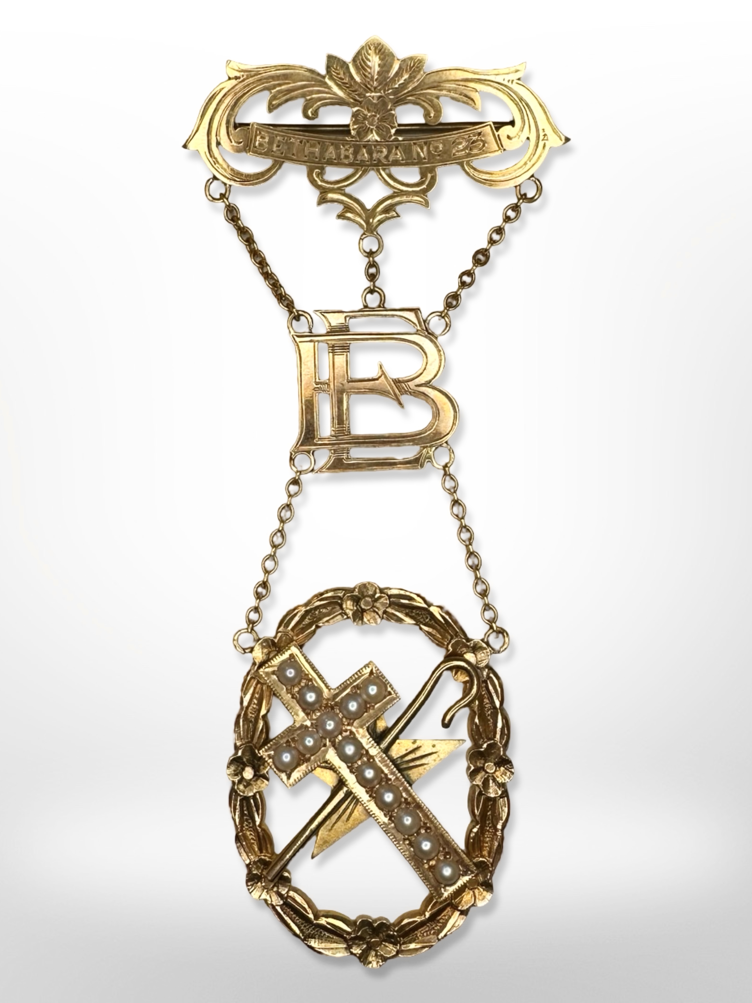 A 9ct yellow gold presentation brooch in three suspended sections mounted to a bar, 'Bethabara No.