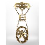 A 9ct yellow gold presentation brooch in three suspended sections mounted to a bar, 'Bethabara No.