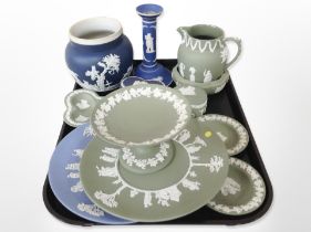 A group of Wedgwood green and blue Jasperware including jugs, candlestick, trinket boxes, etc.