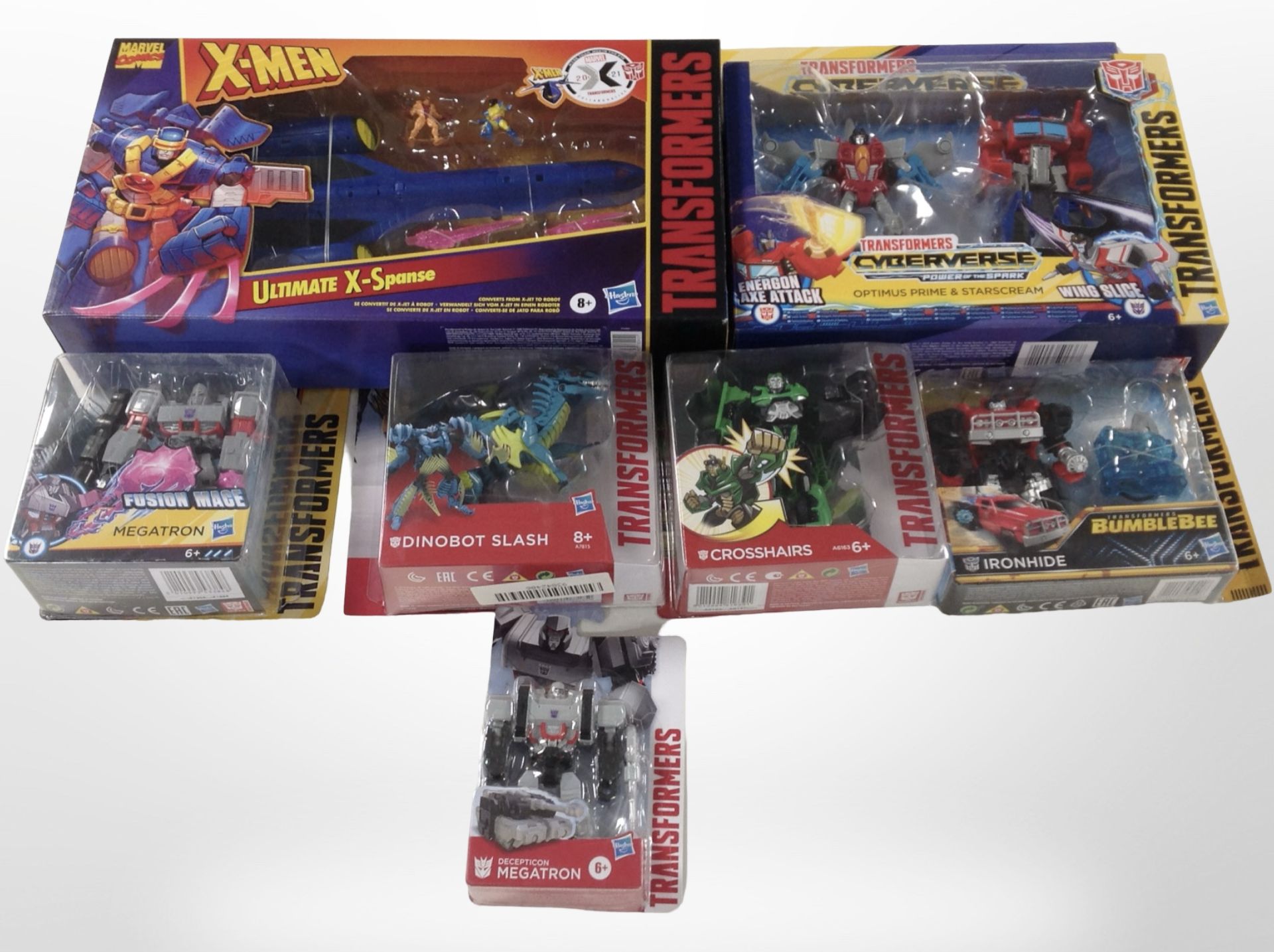 Seven Hasbro Transformers figurines, boxed.