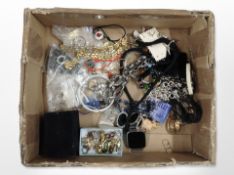 A box of assorted costume jewellery, digital wrist watch, trinkets.