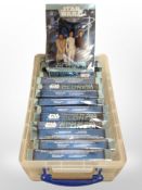 Fourteen Star Wars Attack of the Clones trading card sets.