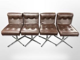 A set of four chrome and brown buttoned leather swivel chairs