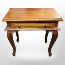 A contemporary hardwood single drawer side table,