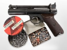 A Webley Senior .177 calibre air pistol and two tins of pellets.