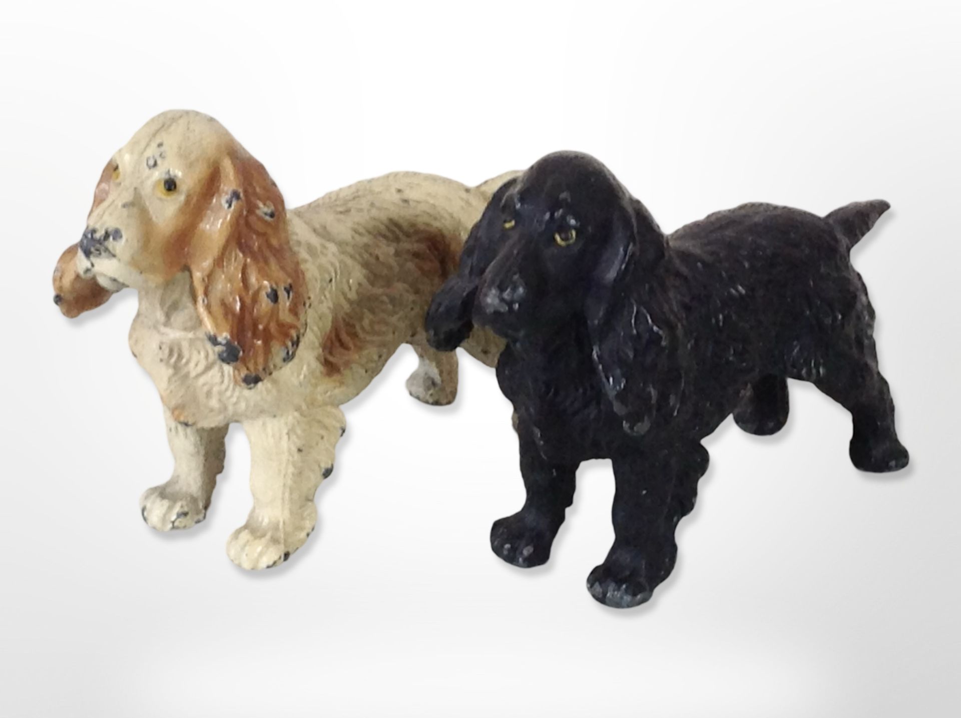 Two painted diecast metal spaniels, length 11cm.