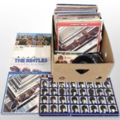 A collection of vinyl LP records and 45 singles, including the Beatles, Frankie Goes To Hollywood,