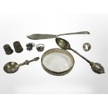 A group of silver items to include bangle, two thimbles, three rings, fish knife, two spoons.