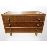 A Danish teak miniature three drawer chest,