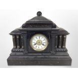 A Victorian ebonised wooden mantel clock with enamelled dial, width 47cm.