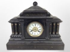 A Victorian ebonised wooden mantel clock with enamelled dial, width 47cm.