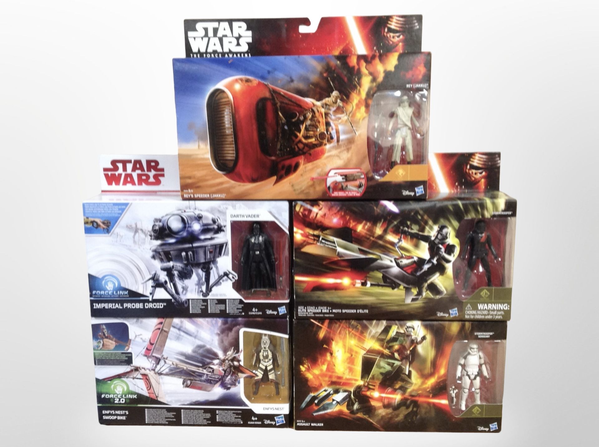 Five Hasbro Disney Star Wars figurines including Assault Walker, Elite Speeder Bike,