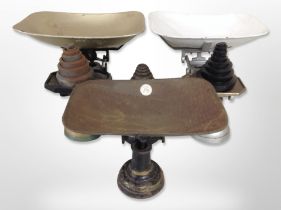 A group of antique enamelled cast-iron scales with weights.