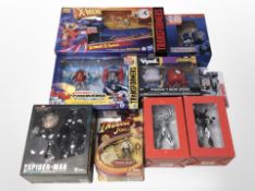 Nine Hasbro and other figures including Transformers, Indiana Jones, Avengers, etc., all boxed.