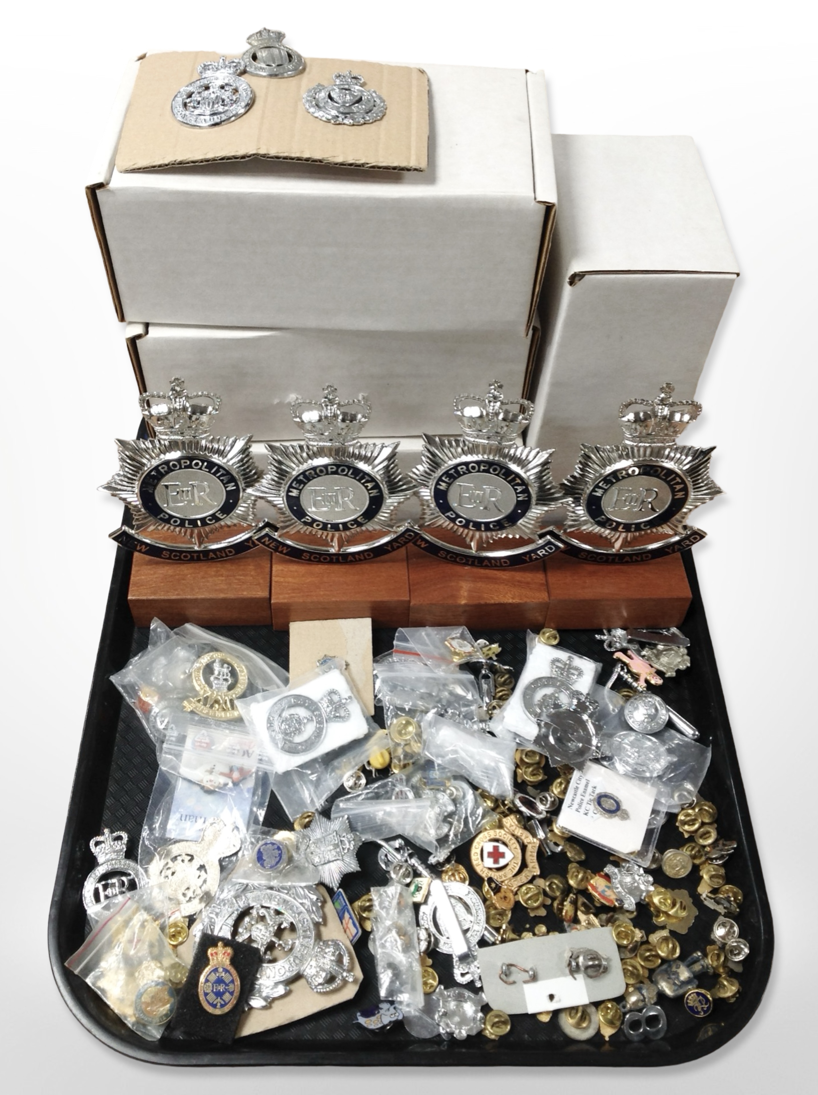 A group of Metropolitan police and other constabulary badges, lapel pins, etc.