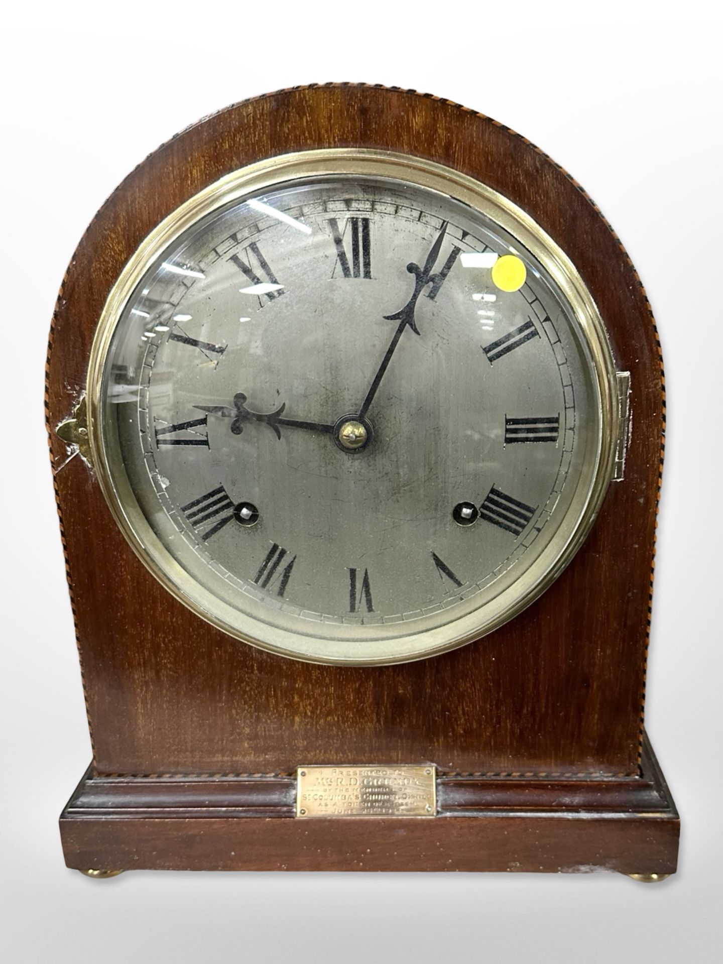 An early 20th-century inlaid mahogany eight-day mantel clock, height 30cm.