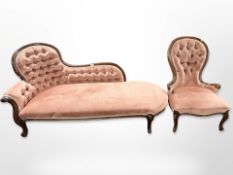 A Victorian style carved chaise loungue in pink buttoned dralon and a matching lady's armchair