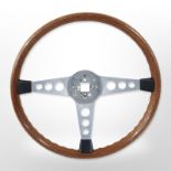 A teak and metal steering wheel.