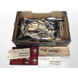 A large quantity of boxed and unboxed cutlery.