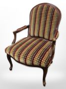 A continental style salon armchair in multi coloured fabric