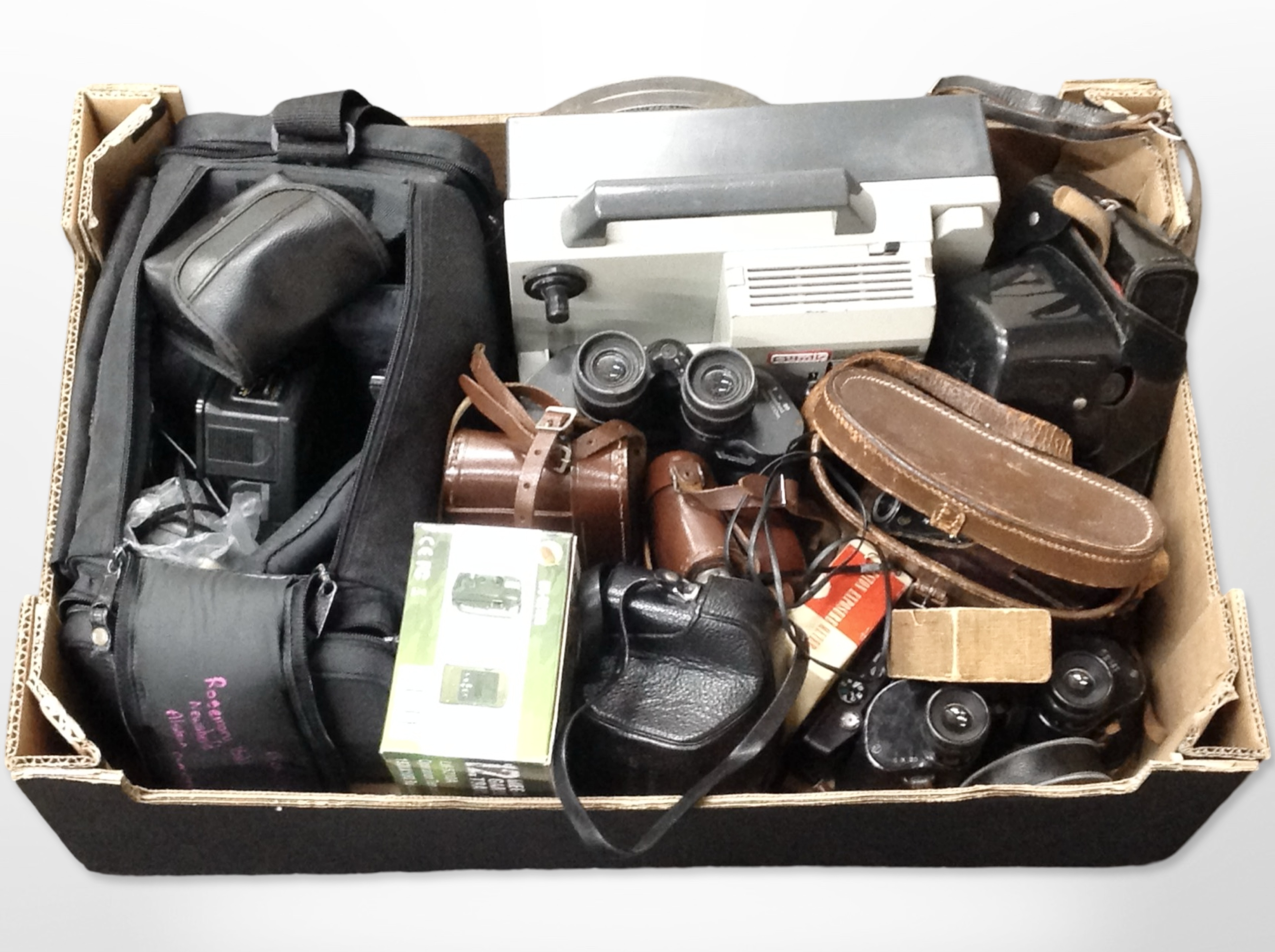 A group of vintage binoculars including Bausch & Lomb, cameras including Mamiya, accessories,