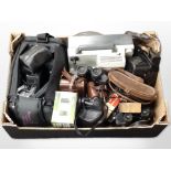 A group of vintage binoculars including Bausch & Lomb, cameras including Mamiya, accessories,